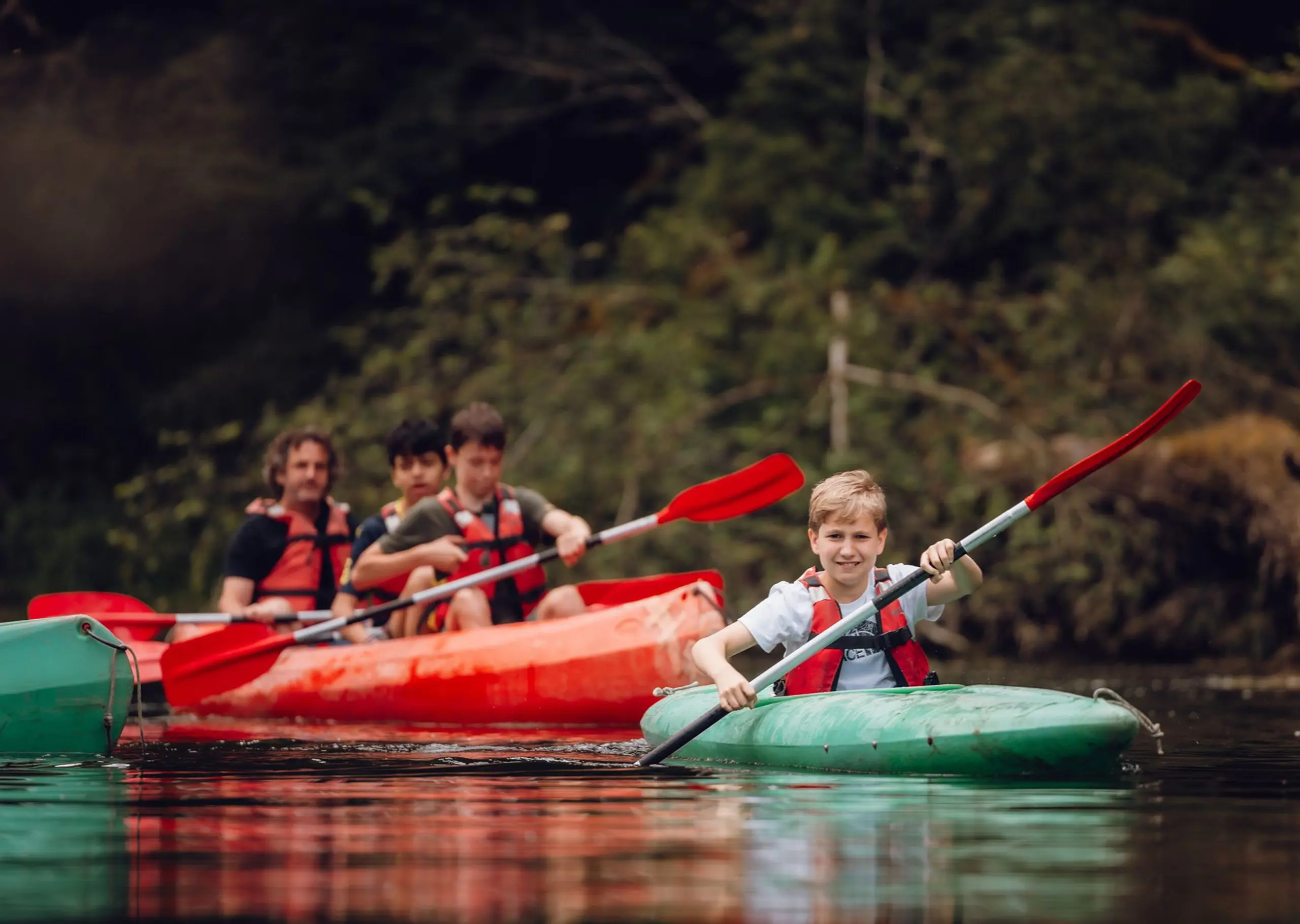 Students in kayaks